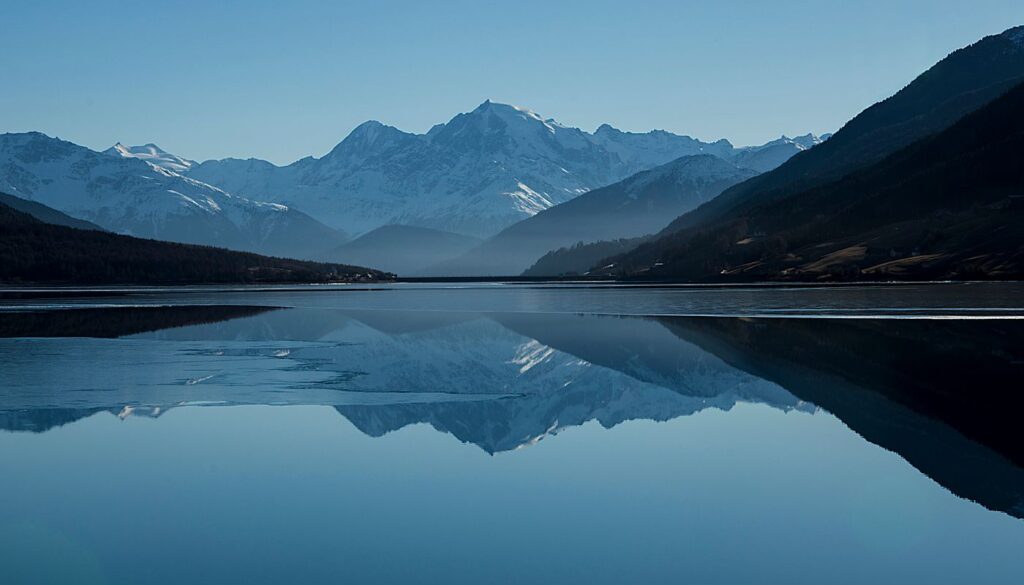 A still lake held between unchanging mountains, an image of prakriti, the constitution you are born with and keep